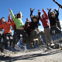 Students jumping at Andes mountain