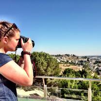 student with camera in israel