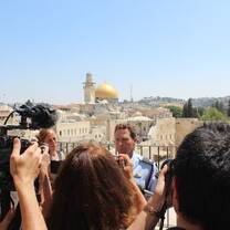 Israeli Police Foreign Spokesman Micky Rosenfeld talking to a pool of reporters. 