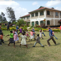 Teaching orphans at the Kithoka home.
