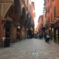 cobblestone walkway down street with buildings