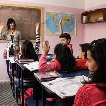 Teacher in front of classroom of students in Armenia