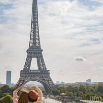Two girls with the Eiffel Tower in the background.