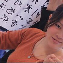 Chinese girl wearing orange shirt