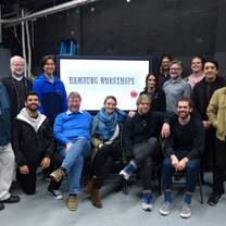 People posing for a photo at a workshop.