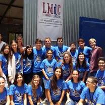 A group of students in blue shirts.