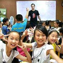 happy kids while their teacher is teaching in front