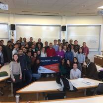 University students holding a tarpaulin.