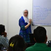 The lady looks like she asking question to her student