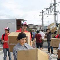 people carrying big boxes
