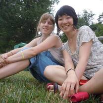 two  ladies sitting on the grass