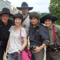 Group of people with a cowboy pose