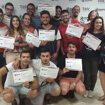 Students holding certificates.