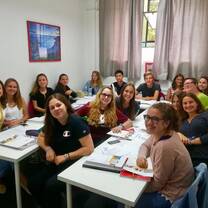group of students sitting inside a classroom