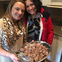 Two ladies showing their food