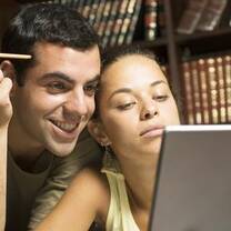 man and women working on their computer