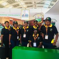 men and women wearing black shirt and cap