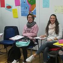 six people sitting on the chair inside the room
