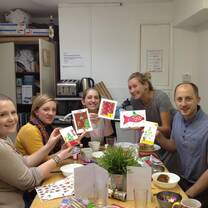 Five people showing a flash card