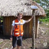 The man standing near the solar energy thing