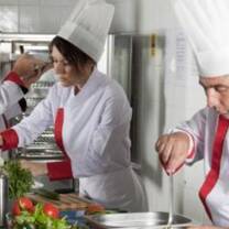 chef and kitchen staff preparing foods