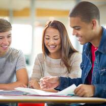 three people reading something