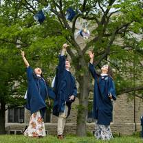 students wearing blue graduation dress