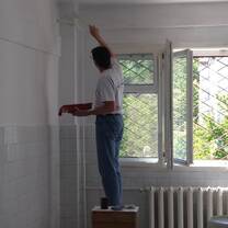 man painting a wall
