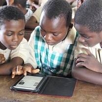 Children reading from a tablet 