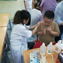 checking a young boy's heart rate