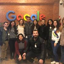 group of participants in front of google sign 
