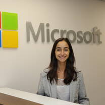 girl in front of Microsoft sign 