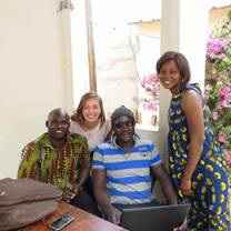 Student smiling with her host family. 