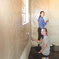 two girls painting room 