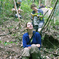 Volunteers in forest tracking lemurs