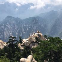 The famed Chess Pavilion on Huashan Mountain in Shaanxi province of central China. One can climb down to the pavilion using a harness system, and view the breathtaking mountain range.