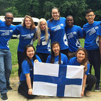 group in all blue with Finland flag