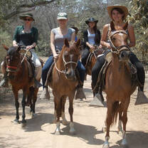 guiding the tours on horseback