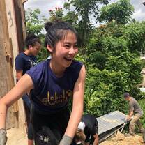 Female volunteer enjoying fun times on the worksite in Puerto Rico.