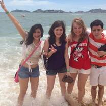American intern and Mexico host family on beach