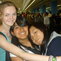 American intern hugging Mexican friends