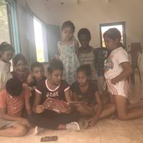 Kids listening to a story in one of the classrooms