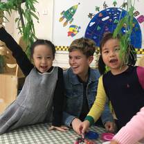 Kindergarten Chinese students with a female American teacher