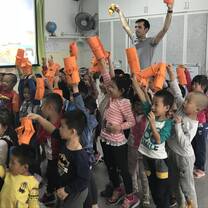 Male teacher with students