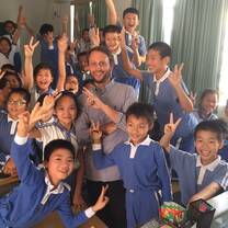 Male teacher with students