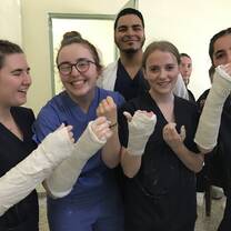 Some of the girls from the placement with myself and one of our mentors. We got to practice putting plaster on each other!