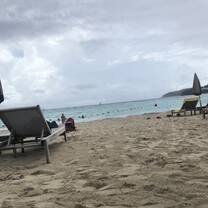 beach chair on the sand in front of the ocean