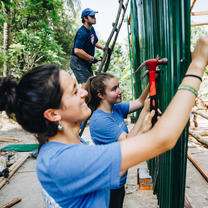 Pacific Discovery students hammering and building in Cambodia