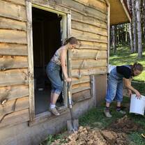 Insulating the outside of the bathhouse at The Driftless Folk School
