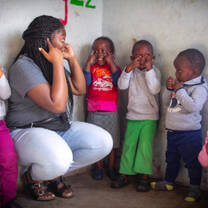 Children playing 'heads, shoulders, knees, and toes'